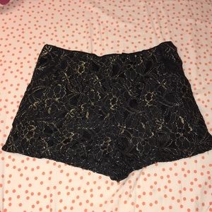 A. PEACH black and gold shorts